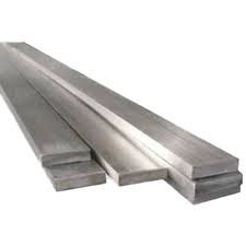 Stacks of industrial stainless steel flat bars with a brushed finish.